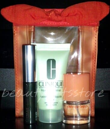 4 Piece Travel / Purse Size Gift Set ~ Clinique Happy For Her Perfume Spray ~ Clinique High Impact Mascara Black Optimal ~ Clinique Dry Combination Skin Liquid Facial Soap in Orange Vinyl Cosmetic Bag w Bow