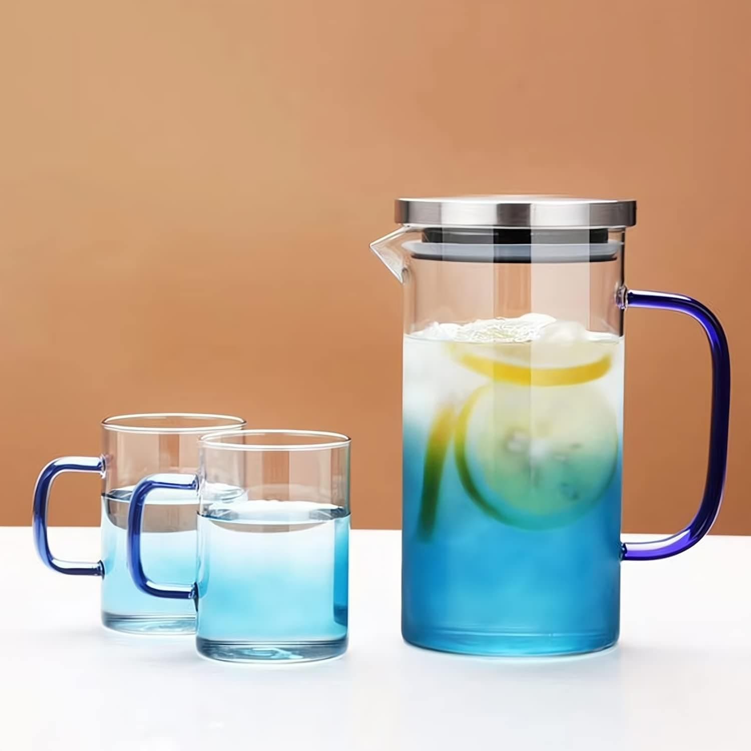 Taiuloo Glass Pitcher with Lid, Spout and Handle, 40 Ounces Water Pitcher with Two Glass Cups, Heat Resistant Borosilicate Glass Carafe for Juice, Iced Tea, Cold or Hot Beverage(Blue)