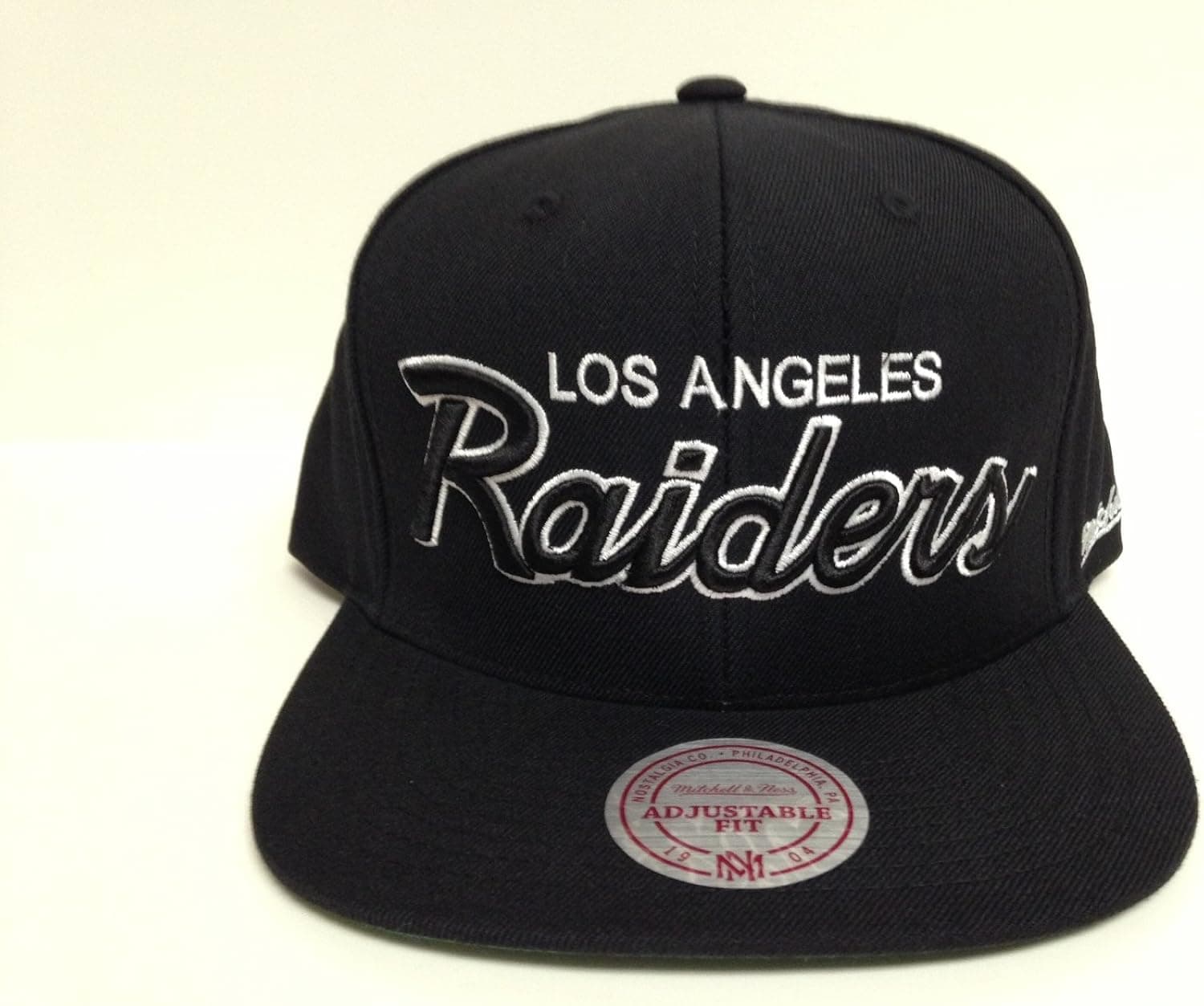 Mitchell & Ness Los Angeles Raiders Script Snapback Hat OSFM (Black-Black)
