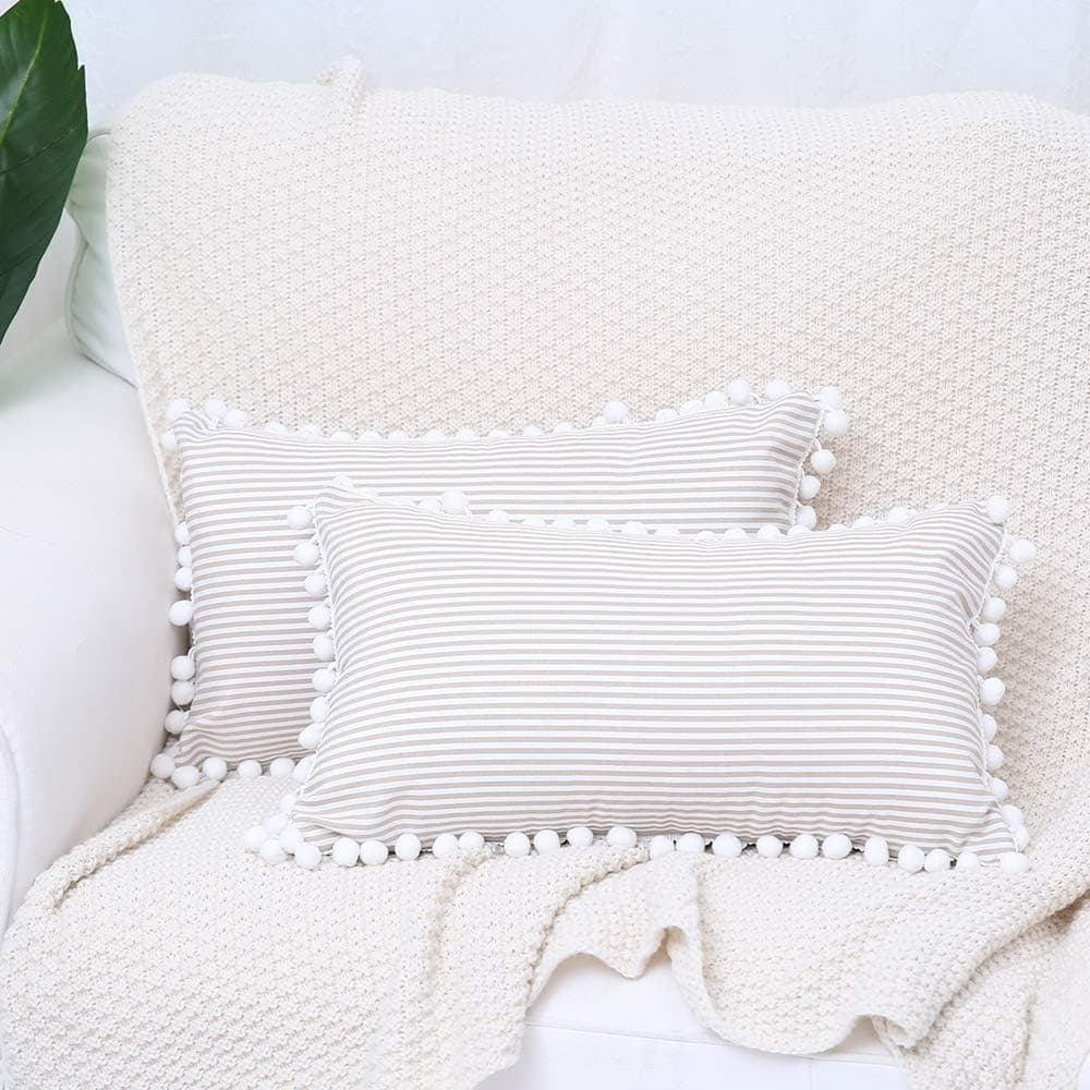 Kiuree Farmhouse Lumbar Pillow Covers with Pom Poms Set of 2 Black and White Outdoor Striped Decorative Throw Pillowcase Cushion Covers for Couch Sofa 12x20 Inch(Light Brown)
