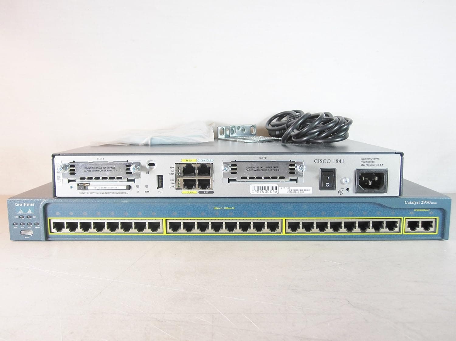 Cisco Systems CCENT CCNA CCNP CCSP CCIE Lab Kit Bundle - Cisco 1841 ISR Router and a Cisco WS-C2950T-24 Switch(2950T 24 Switch-24 10/100 Mbps ports with two fixed 10/100/1000BASE-T uplinks) - Router IOS Image is: c1841-adventerprisek9-mz.151-4.M1.bin Advanced Enterprise IOS