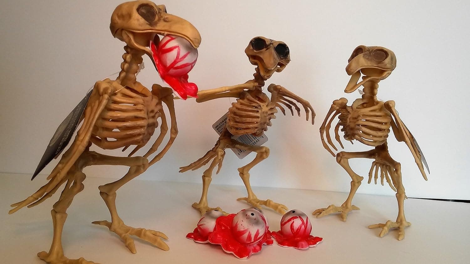 Greenbrier Halloween Bird Skeleton Decorations Carrying 5 Creepy Bloody Gouged Out Eyeballs - 3 Life Size Standing Skeletal Crows 7" Tall with Posable Wings and Beak