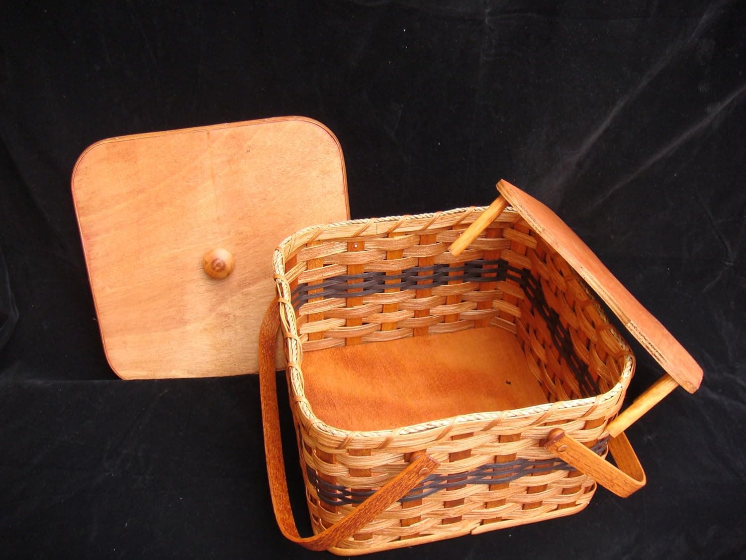 Amish Handmade Square Double Pie Carrier Basket with Two Swinging Handles, a Wooden Tray, and a Lid, 11 1/2" Length X 11 1/2" Width X 7 1/2" Height. Also Called Pie Tote, Pie Taker, Pie Holder, Pie Plate Holder. Whatever You Call It, It Is a Beautiful and Well Constructed Basket Made Especially to Transport Those Delicate Homemade Pies Safely to the Family Gathering, Church Social, Fund Raiser Bake Sale, or Work Related Pot-luck. This Basket Has Many Uses Beyond Carrying Pies In. The Double Pie Baskets Are Our Best Seller! All Eyes Will Be on This Basket, so Make Sure Not to Let It Out of Your Sight! This Is a Great Unique Gift Idea for Any Country Home and Garden Decor. The Amish Basket Will Match Any Decoration. Amish Handmade Square Double Pie Carrier Basket with Wood Tray and Lid Two Wooden Handles. Possibility of Fresh Stain Odor, Will Need to Be Aired Out Upon Product Arrival