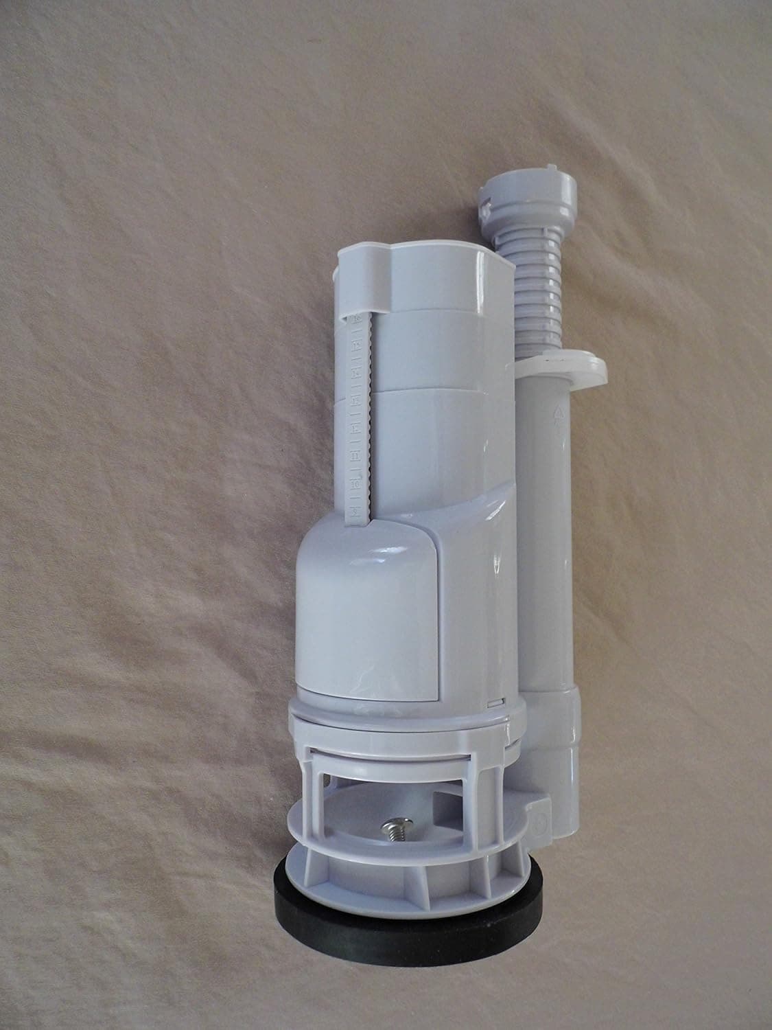 Dual Flush Top Button, Two Piece Toilet Replacement, Top Operated Dual Flush Valve Two Inch Flush Outlets Eight inches Tall.