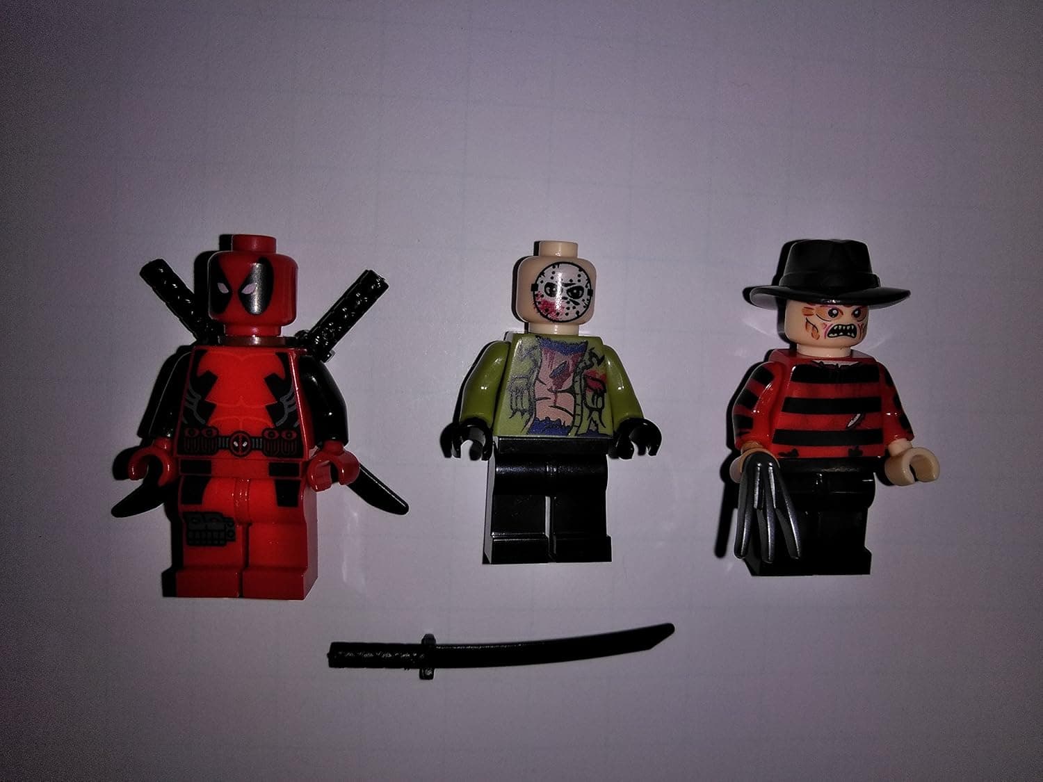 unknown manufacture Jason Freddy and Deadpool KO Minifigure lot in Clear Bag Sealed Condition:Comes with Free Gold Optimus Prime Bonus